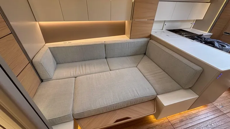 Zenith Yacht Photos Pics Luxurious interior of 2023 Italia Yachts 14.98, featuring a modern, comfortable seating area.