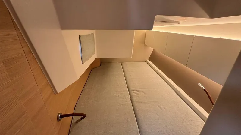 Zenith Yacht Photos Pics 2023 Italia Yachts 14.98 interior cabin with modern design and cozy sleeping area.