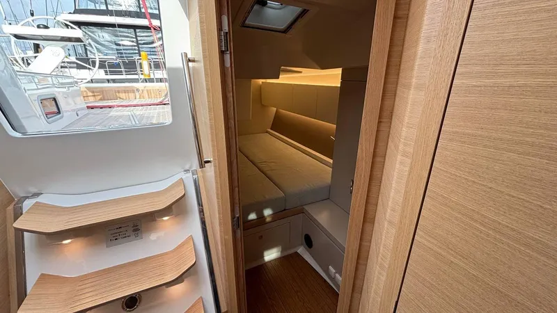 Zenith Yacht Photos Pics Luxurious interior cabin of 2023 Italia Yachts 14.98, featuring modern wood finishes.