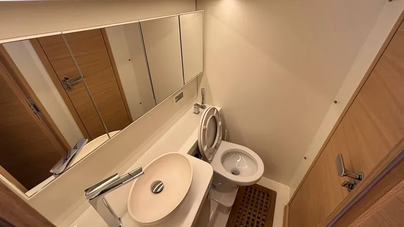 Zenith Yacht Photos Pics Luxurious bathroom in 2023 Italia Yachts 14.98, featuring modern sink and toilet.