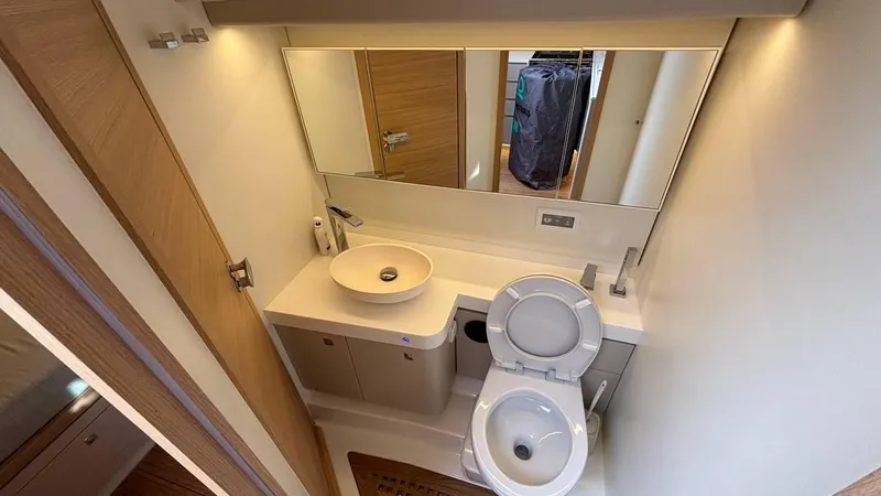 Zenith Yacht Photos Pics Modern bathroom in 2023 Italia Yachts 14.98, featuring sleek fixtures and ample lighting.