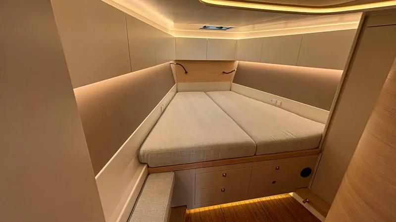 Zenith Yacht Photos Pics Luxurious cabin interior of 2023 Italia Yachts 14.98, featuring modern design and ambient lighting.