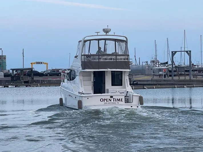 Open Time Yacht Photos Pics 2006 Silverton 34 Convertible boat named "Open Time" in a marina setting.