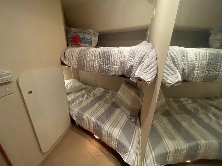 Open Time Yacht Photos Pics Bunk beds in 2006 Silverton 34 Convertible yacht cabin with striped bedding.