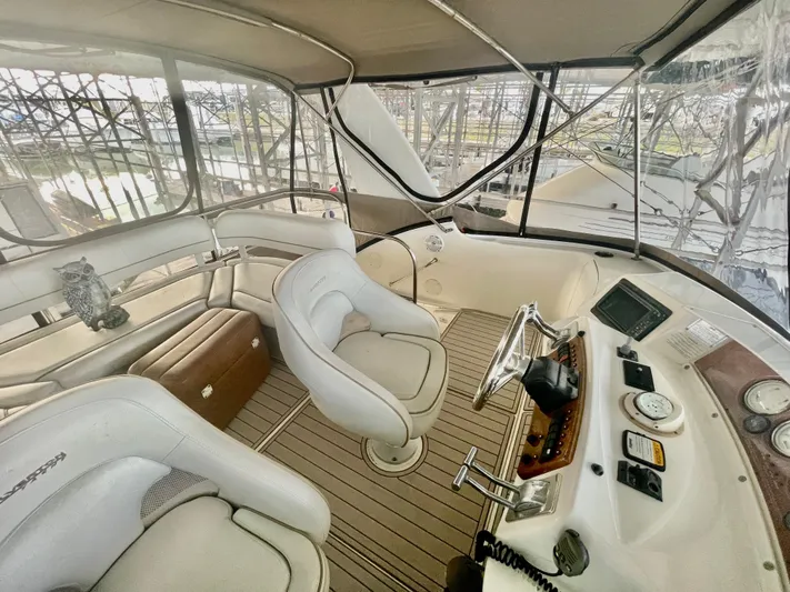 Open Time Yacht Photos Pics 2006 Silverton 34 Convertible yacht interior with helm, seating, and navigation equipment.