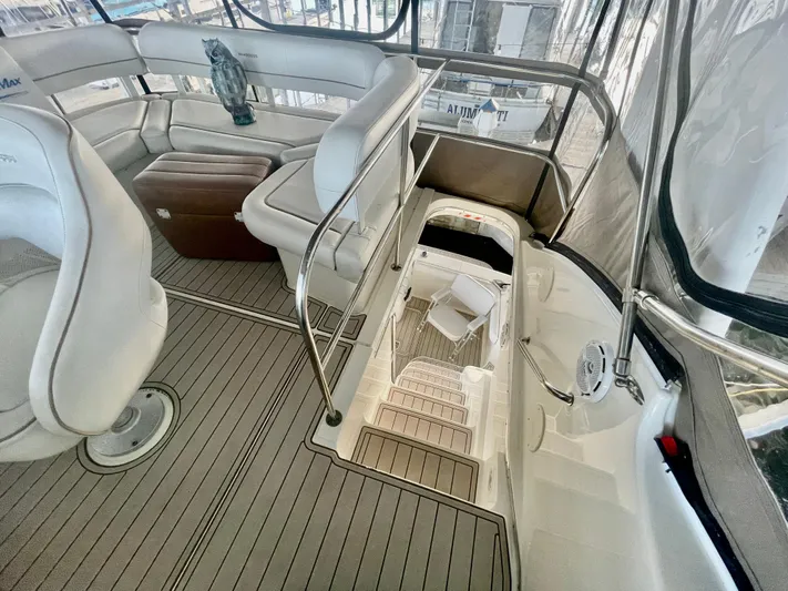 Open Time Yacht Photos Pics 2006 Silverton 34 Convertible yacht interior with white seating and wooden flooring.