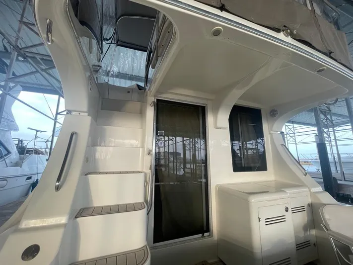 Open Time Yacht Photos Pics 2006 Silverton 34 Convertible yacht interior with stairs and storage compartments.