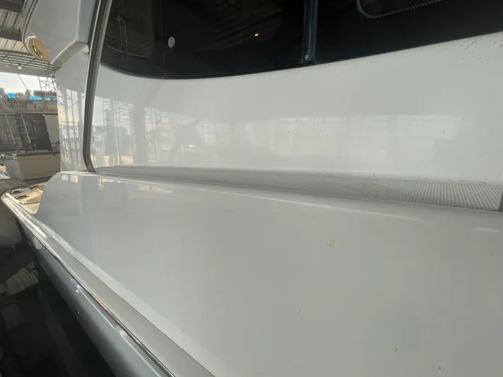 Open Time Yacht Photos Pics 2006 Silverton 34 Convertible boat side view in a marina setting.