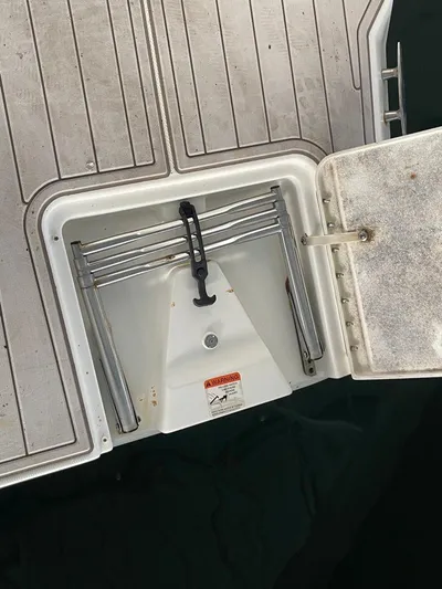 Open Time Yacht Photos Pics 2006 Silverton 34 Convertible boat ladder compartment on deck.