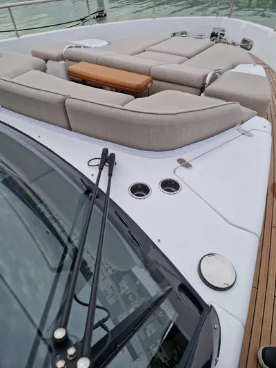  Yacht Photos Pics 2025 Azimut Magellano 60 yacht with luxurious deck seating and sleek design.