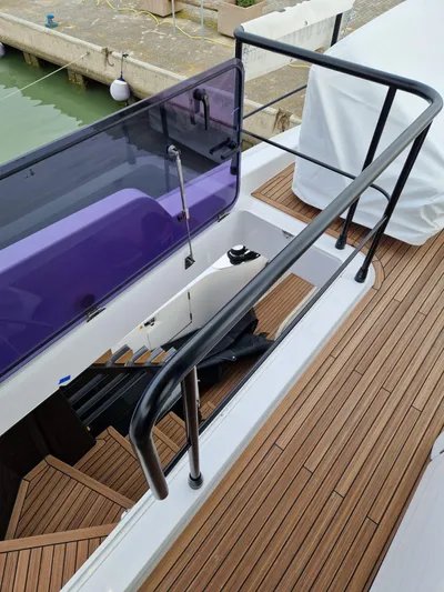  Yacht Photos Pics 2025 Azimut Magellano 60 yacht deck with wooden flooring and sleek railings.