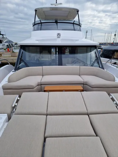  Yacht Photos Pics 2025 Azimut Magellano 60 yacht with spacious deck and luxurious seating.