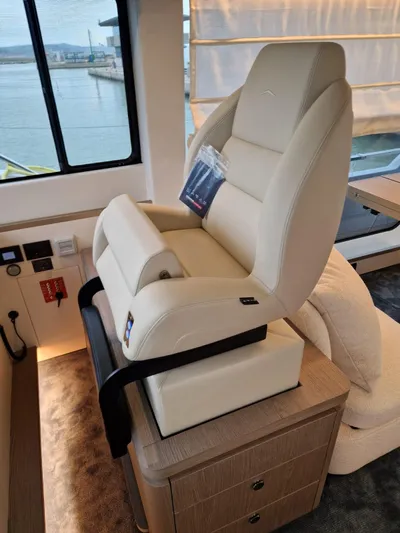  Yacht Photos Pics Luxury interior of 2025 Azimut Magellano 60 yacht with plush captain's chair.