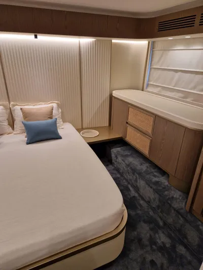  Yacht Photos Pics Luxurious bedroom interior of 2025 Azimut Magellano 60 yacht with modern design.