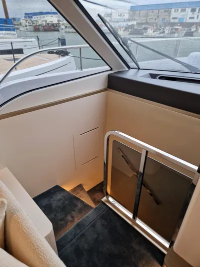  Yacht Photos Pics Interior view of 2025 Azimut Magellano 60 yacht, featuring sleek stairs and modern design.