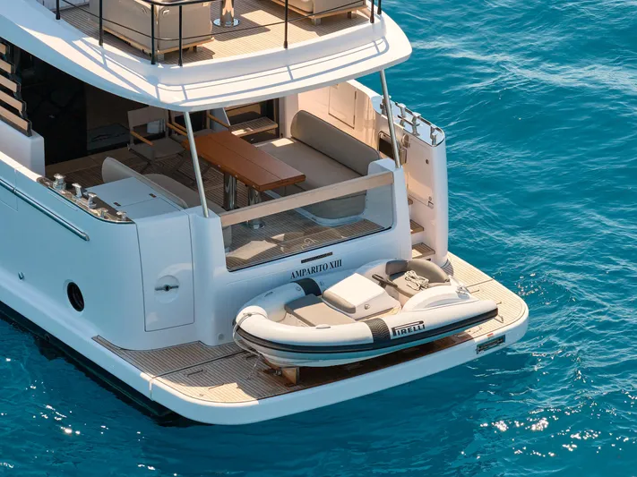  Yacht Photos Pics 2025 Azimut Magellano 60 yacht with tender on blue ocean water.