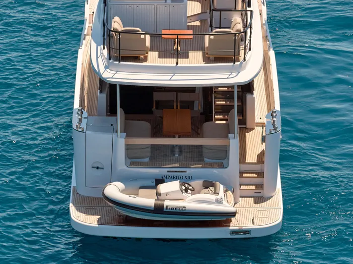  Yacht Photos Pics 2025 Azimut Magellano 60 yacht with tender, viewed from above on clear blue water.