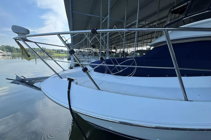  Yacht Photos Pics 1998 Carver 405 Motor Yacht docked, featuring sleek design and stainless steel railings.