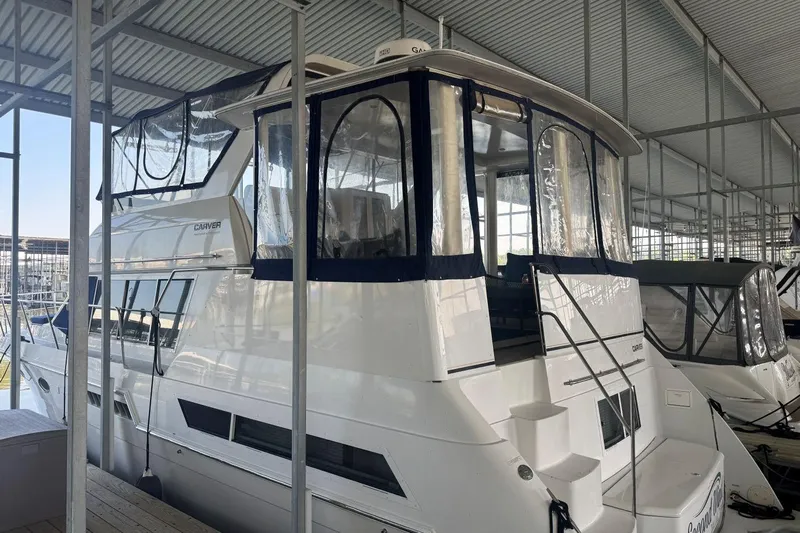  Yacht Photos Pics 1998 Carver 405 Motor Yacht docked in a covered marina.