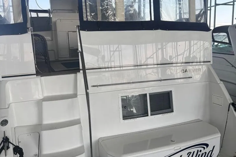  Yacht Photos Pics 1998 Carver 405 Motor Yacht with white exterior and covered deck area.