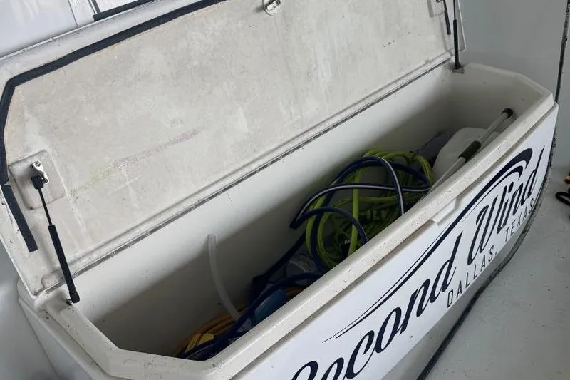  Yacht Photos Pics Open storage compartment on Carver 405 Motor Yacht, 1998, with hoses and equipment inside.