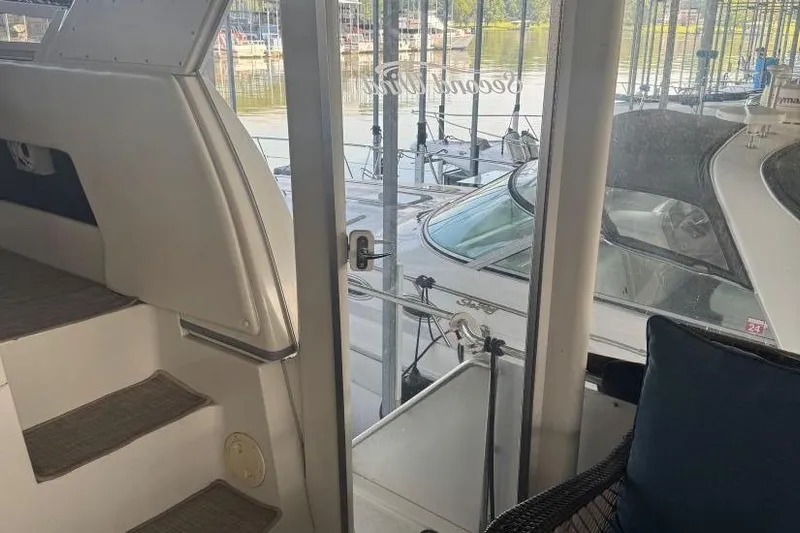  Yacht Photos Pics 1998 Carver 405 Motor Yacht interior view with marina backdrop.