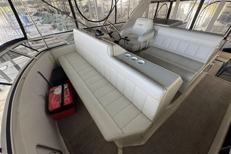  Yacht Photos Pics 1998 Carver 405 Motor Yacht interior with white seating and helm station.