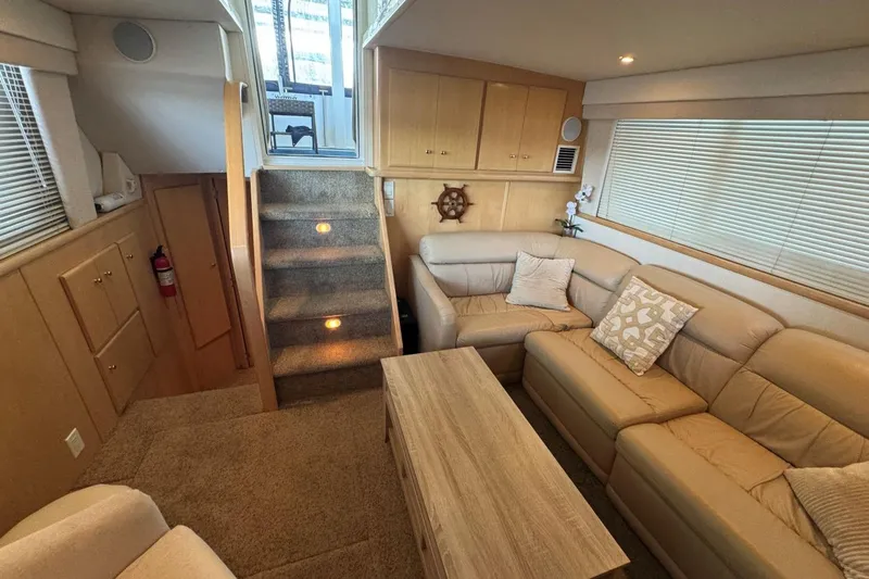  Yacht Photos Pics Interior of 1998 Carver 405 Motor Yacht with cozy seating and wooden accents.