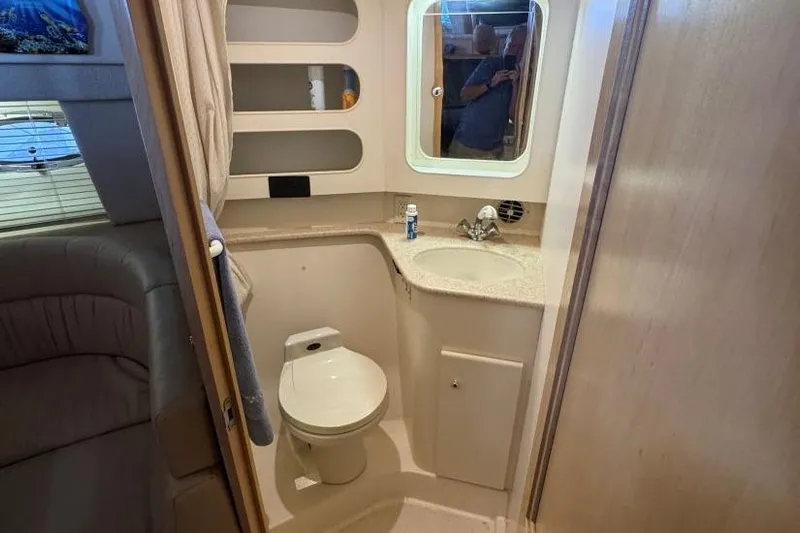  Yacht Photos Pics Bathroom interior of 1998 Carver 405 Motor Yacht with toilet, sink, and mirror.