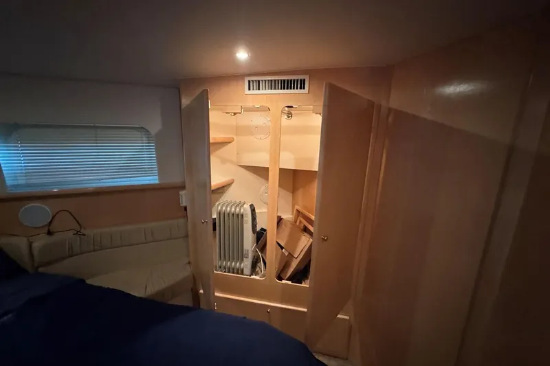  Yacht Photos Pics Interior of 1998 Carver 405 Motor Yacht with open closet and heater.