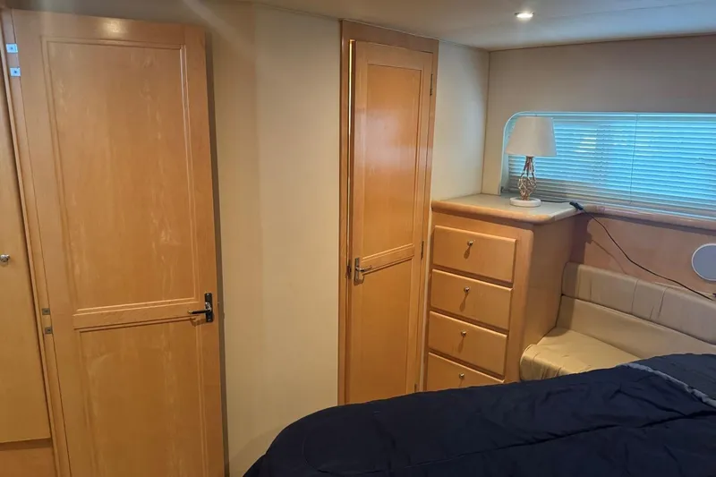  Yacht Photos Pics Interior of 1998 Carver 405 Motor Yacht with wooden cabinetry and cozy seating area.