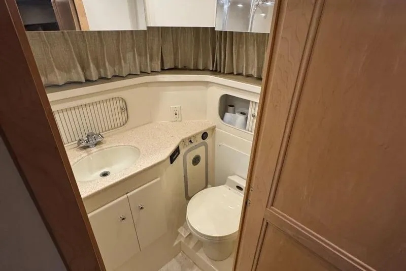  Yacht Photos Pics Bathroom interior of 1998 Carver 405 Motor Yacht with sink and toilet.