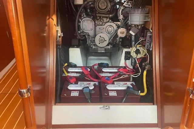 Plein Air Yacht Photos Pics Engine compartment of a 2006 Beneteau 423 sailboat, featuring batteries and wiring.