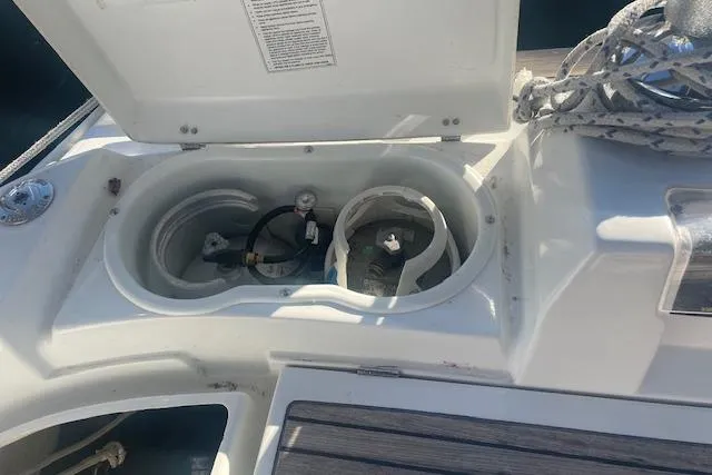 Plein Air Yacht Photos Pics Storage compartment on a 2006 Beneteau 423 sailboat, featuring propane tank holders.