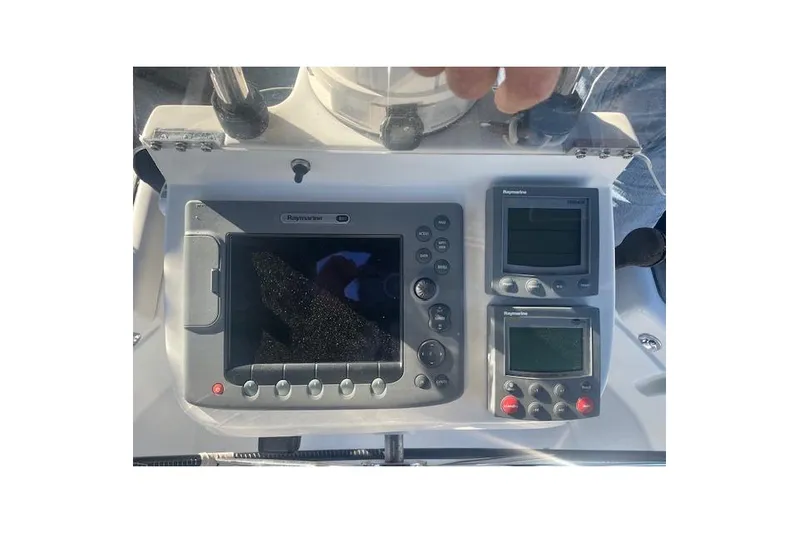 Plein Air Yacht Photos Pics Control panel of a 2006 Beneteau 423 sailboat with Raymarine navigation equipment.