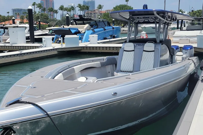  Yacht Photos Pics 2019 Statement 380 Open boat docked in marina, featuring sleek design and modern seating.