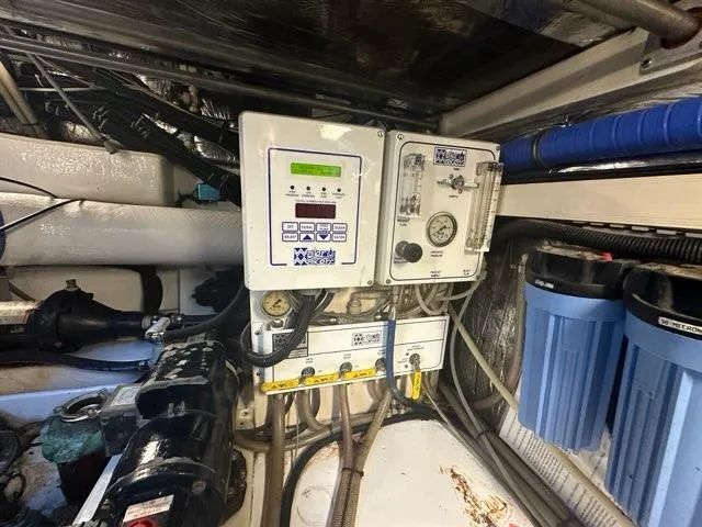 Mirabella Yacht Photos Pics Engine room of 1996 Tiara Yachts 43 Open with control panels and filters.