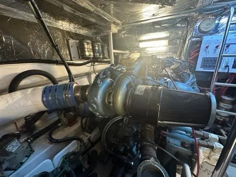 Mirabella Yacht Photos Pics Engine room of 1996 Tiara Yachts 43 Open, showcasing mechanical components and wiring.