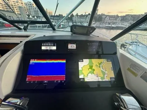 Mirabella Yacht Photos Pics Tiara Yachts 1996 43 Open dashboard with navigation screens and marina view.