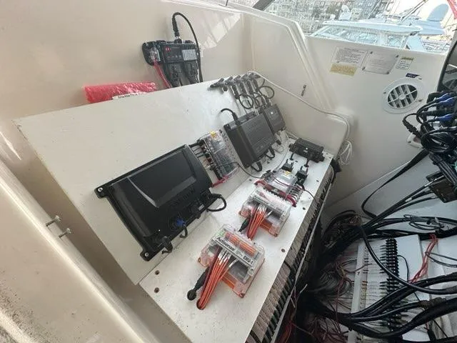 Mirabella Yacht Photos Pics 1996 Tiara Yachts 43 Open electronic control panel with wiring and equipment.