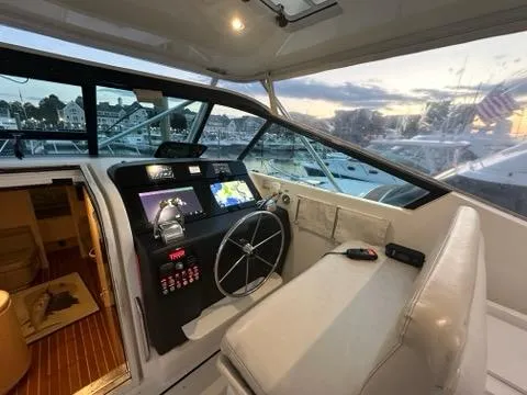 Mirabella Yacht Photos Pics 1996 Tiara Yachts 43 Open helm with modern navigation, marina view at sunset.