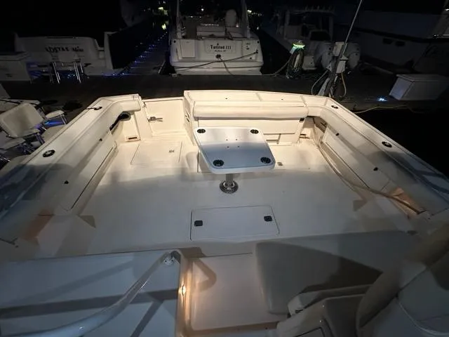 Mirabella Yacht Photos Pics 1996 Tiara Yachts 43 Open boat deck with seating and table, illuminated at night.