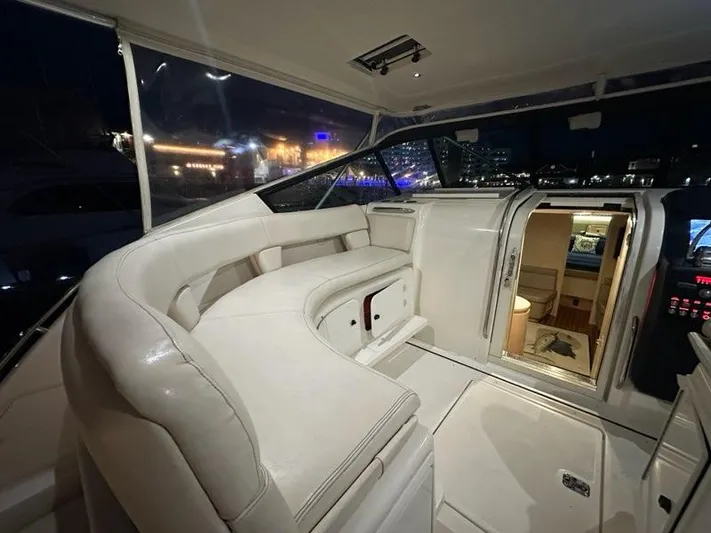 Mirabella Yacht Photos Pics Luxurious interior of 1996 Tiara Yachts 43 Open at night.