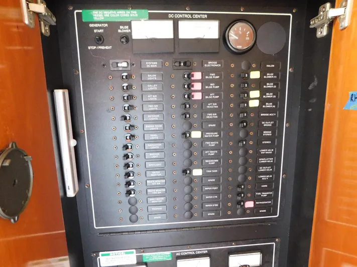 Justified Insanity II Yacht Photos Pics Control panel of a 2003 Carver 444 Cockpit Motor Yacht, featuring various switches and gauges.