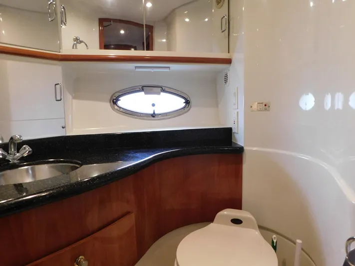 Justified Insanity II Yacht Photos Pics Luxurious bathroom in 2003 Carver 444 Cockpit Motor Yacht with sleek design and modern fixtures.