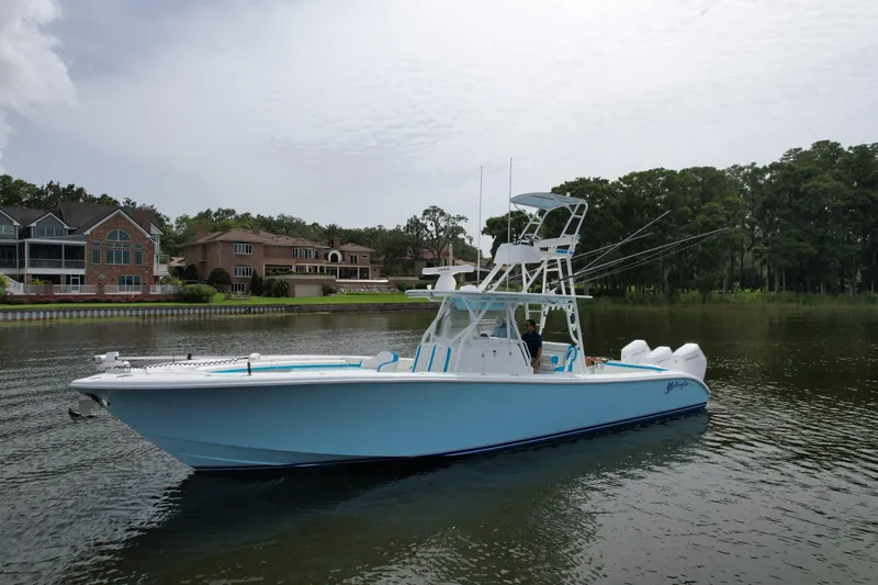  Yacht Photos Pics 2016 Yellowfin 39 Offshore boat on calm water near residential area.