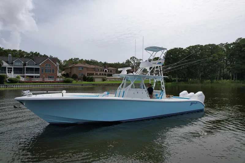  Yacht Photos Pics 2016 Yellowfin 39 Offshore boat on calm water near residential area.