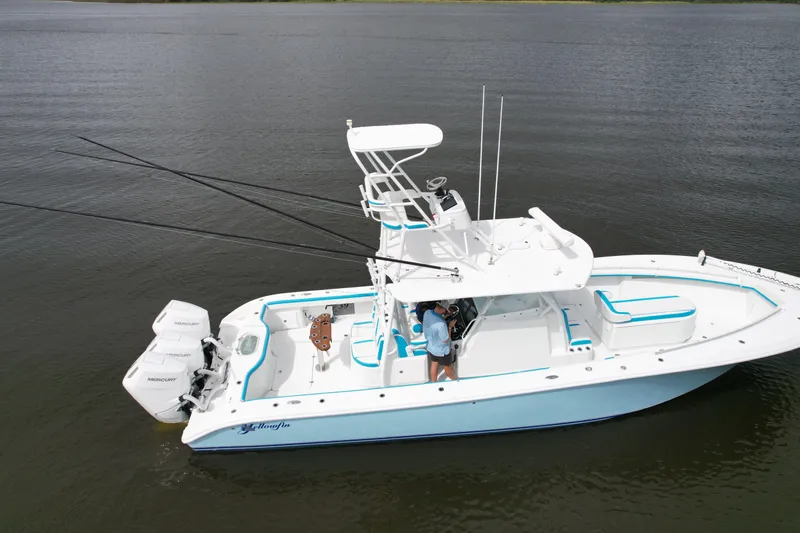  Yacht Photos Pics 2016 Yellowfin 39 Offshore boat on calm water, featuring dual outboard engines.