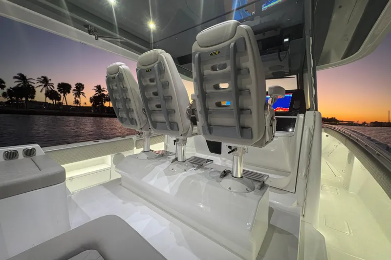 Yacht Photos Pics Interior of 2026 HCB 56 Suenos GIX boat at sunset, featuring luxurious seating and modern design.