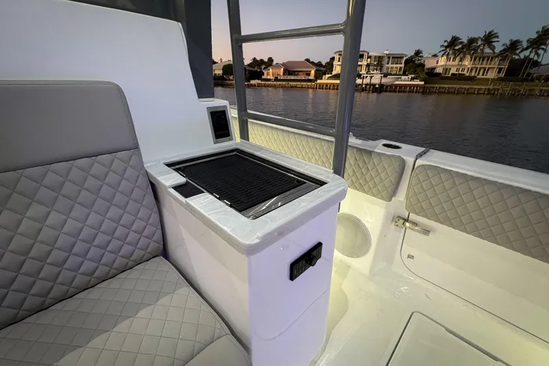  Yacht Photos Pics Luxury seating and grill on 2026 HCB 56 Suenos GIX boat, waterfront view.